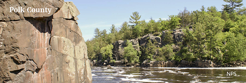 Polk County Named 800 A river runs through wooded cliffs